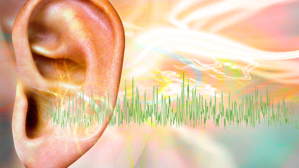 A human ear with an image of a soundwave superimposed over it representing the psychology of voiceover for elearning.